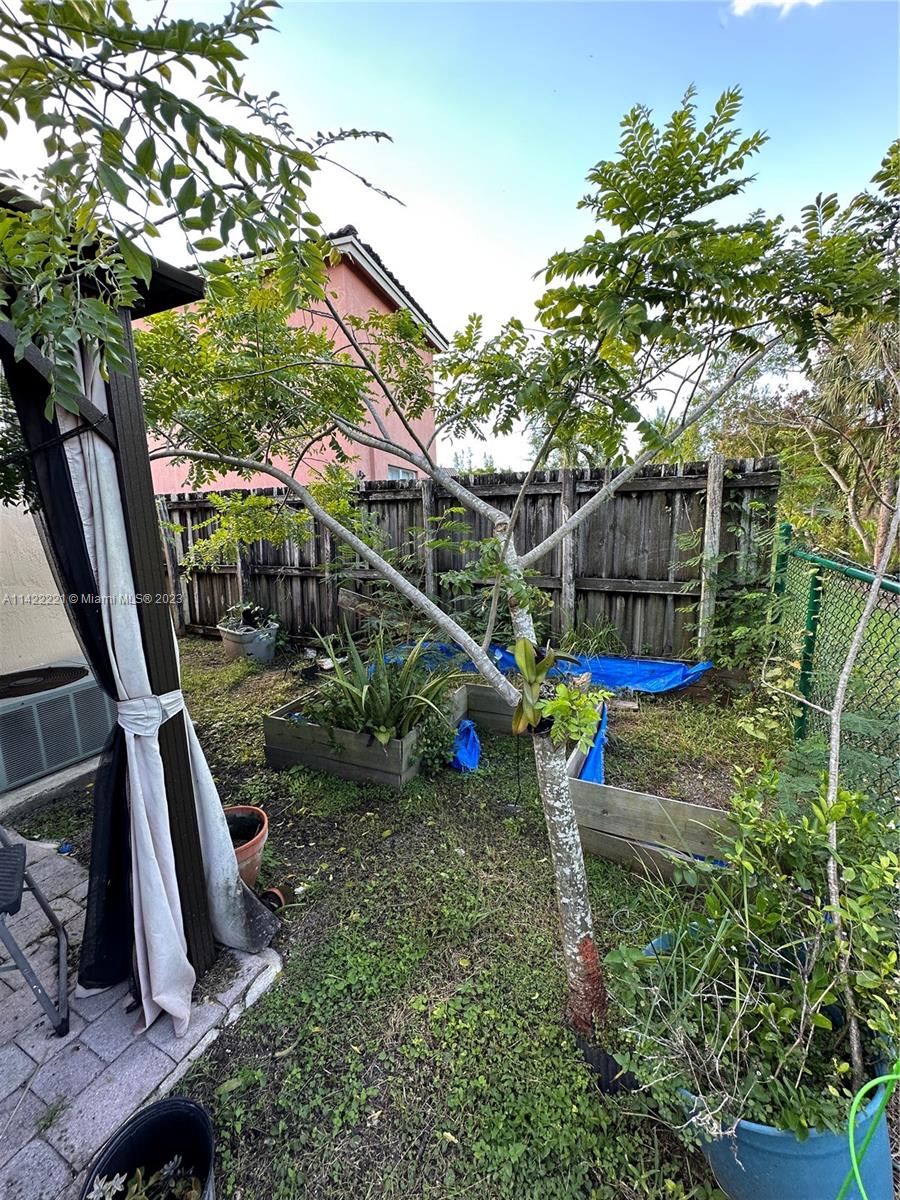 1041 Southeast 20th Road Homestead, FL 33035 - Photo 38 of 40 a view of a park with iron fence