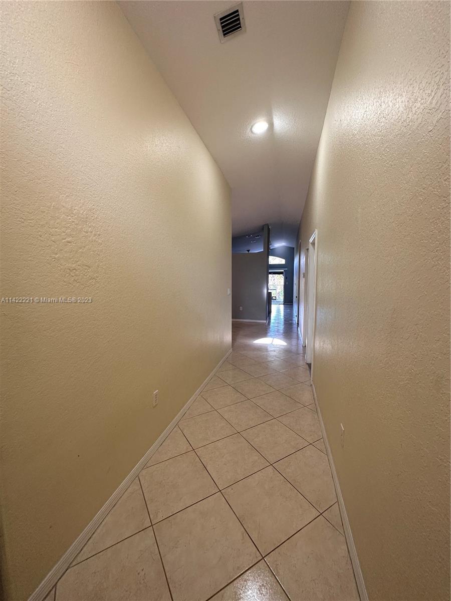 1041 Southeast 20th Road Homestead, FL 33035 - Photo 5 of 40 a view of livingroom and hallway