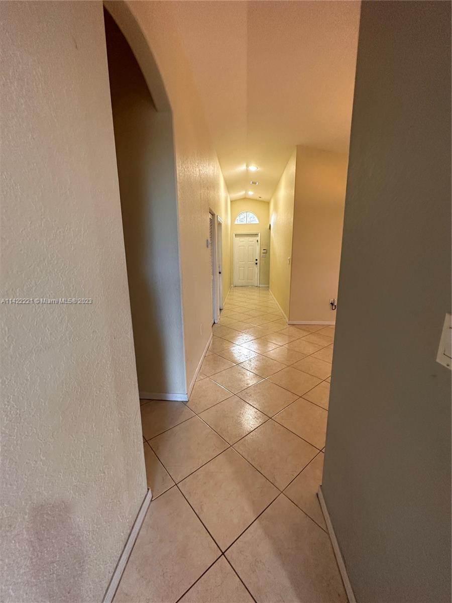 1041 Southeast 20th Road Homestead, FL 33035 - Photo 6 of 40 a view of a hallway
