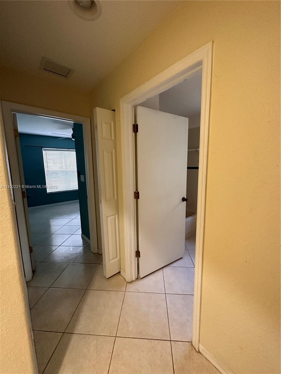 1041 Southeast 20th Road Homestead, FL 33035 - Photo 7 of 40 a view of a hallway