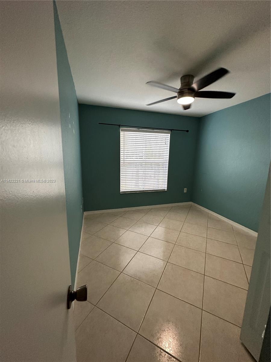 1041 Southeast 20th Road Homestead, FL 33035 - Photo 10 of 40 a view of an empty room and window