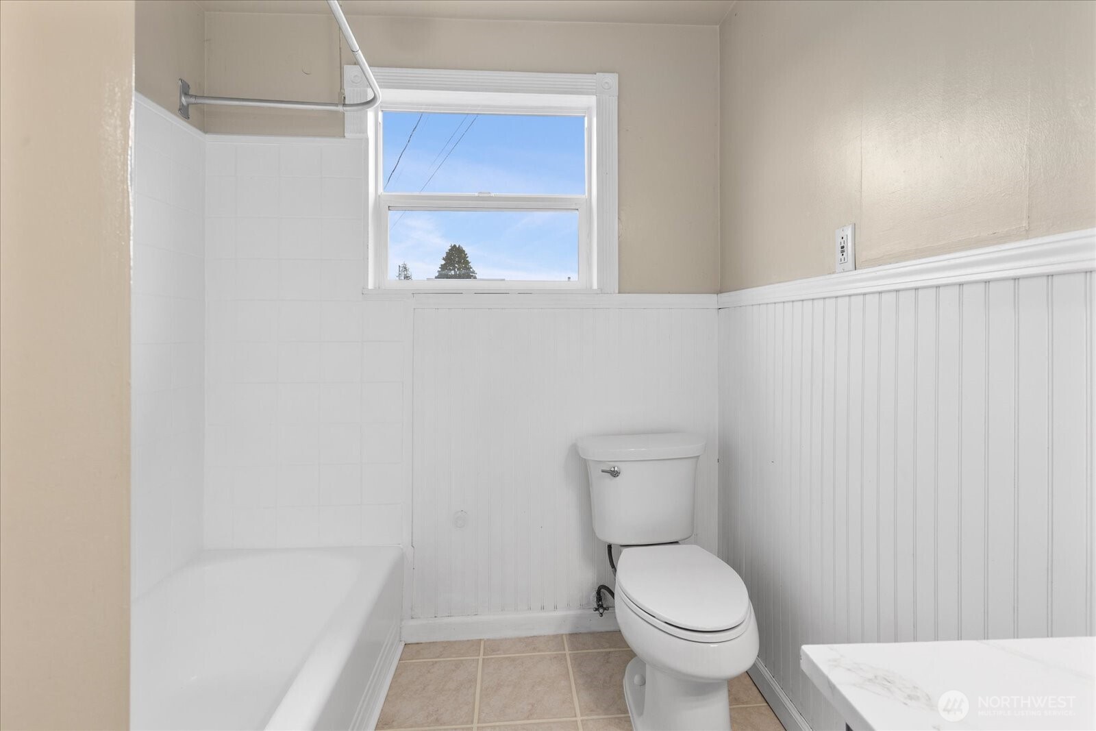 1016 Rockefeller Avenue Everett, WA 98201 - Photo 13 of 29 a white toilet sitting next to a shower