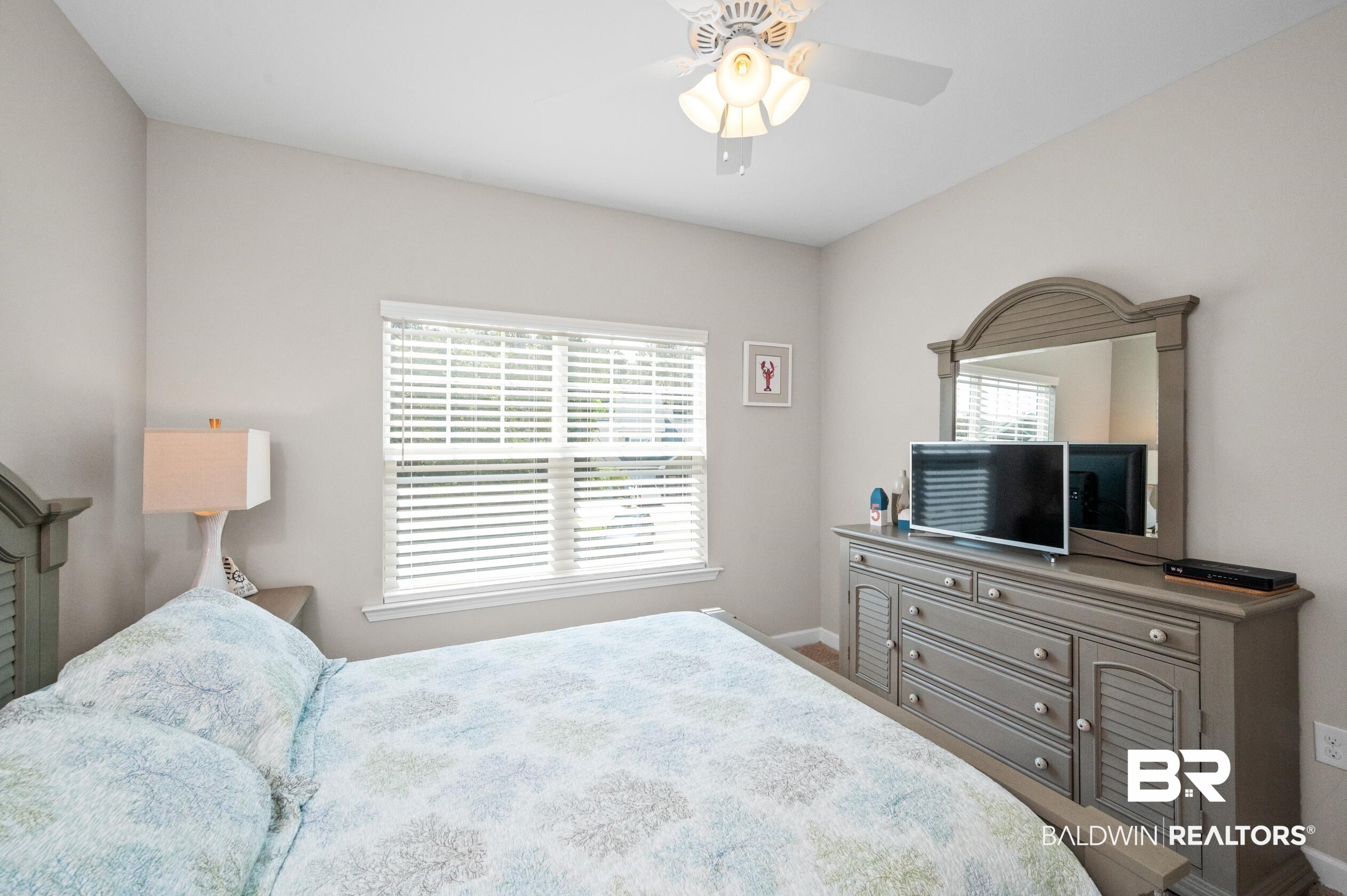 430 West Fort Morgan Road, Unit 1902 Gulf Shores, AL 36542 - Photo 35 of 59 Bedroom with ceiling fan