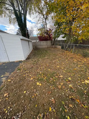 a backyard of a house with lots of green space