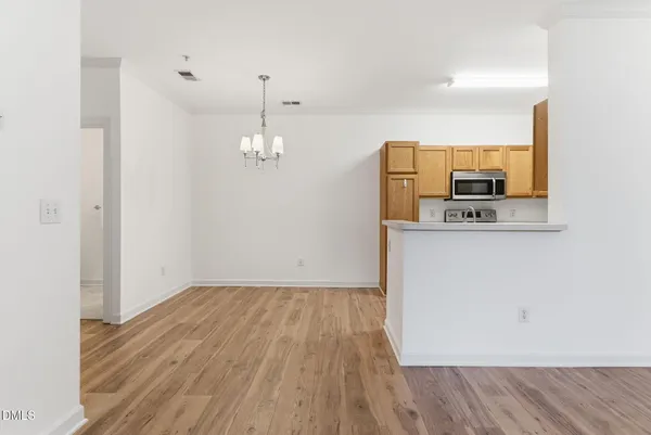 a view of cabinets and wooden floor