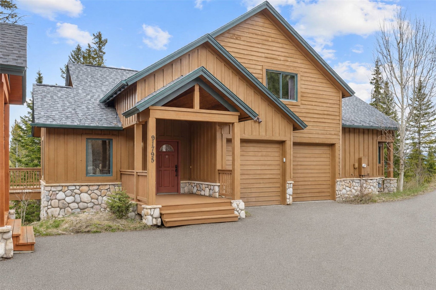 91795 Ryan Gulch Road Silverthorne, CO 80498 - Photo 9 of 50 a front view of a house with a yard