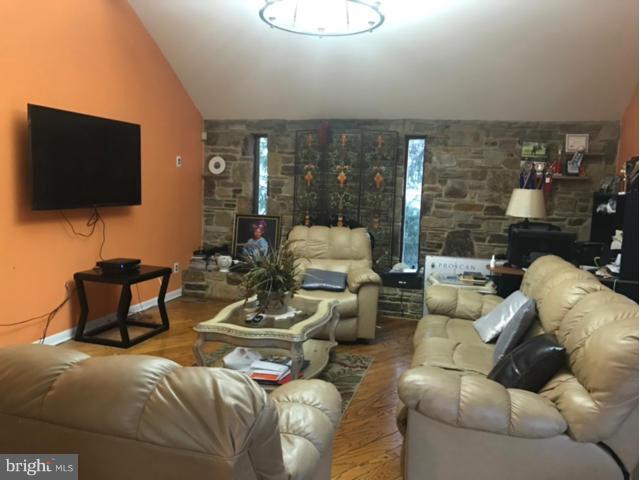 8514 Contee Road Laurel, MD 20708 - Photo 14 of 21 a living room with furniture and a flat screen tv