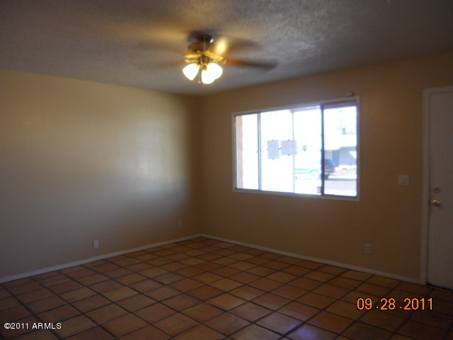 2901 West Bloomfield Road Phoenix, AZ 85029 - Photo 3 of 9 a view of a livingroom with a chandelier fan