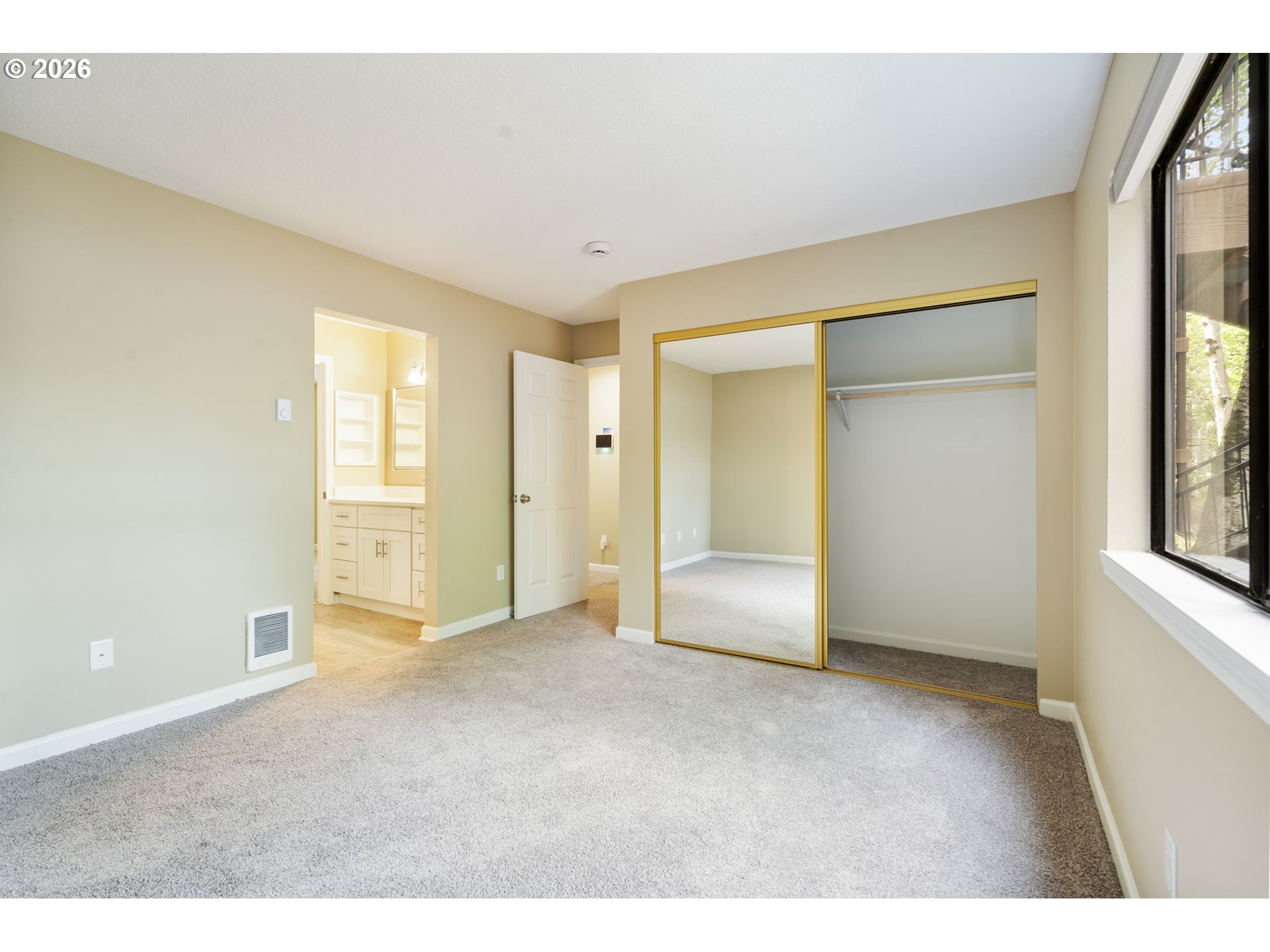 9967 Southeast Talbert Street Clackamas, OR 97015 - Photo 22 of 33 an empty room with windows and closet