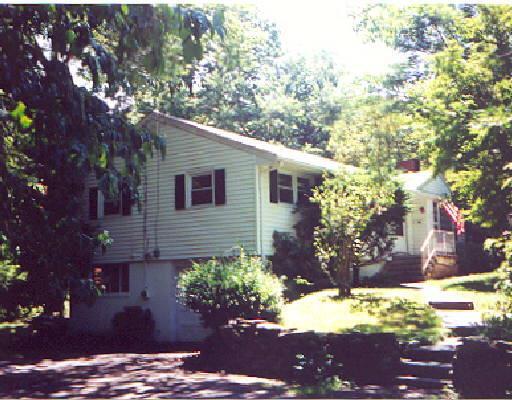 45 Walker Road Trumbull, CT 06611 - Photo 1 of 1 a view of a backyard with a large tree