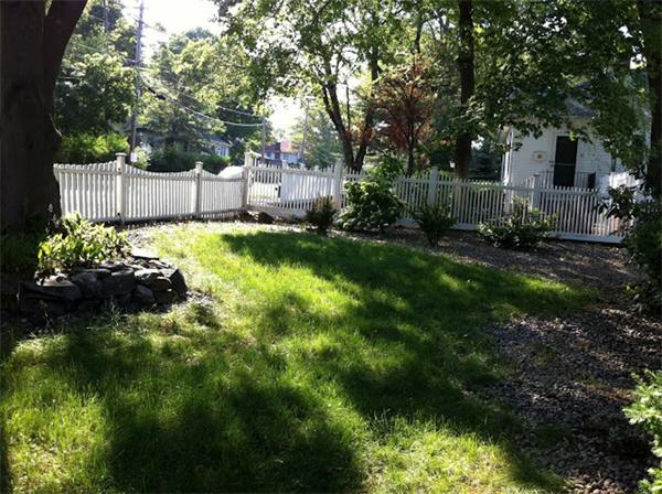 261 Marrett Road Lexington, MA 02421 - Photo 4 of 24 a backyard of a house with lots of green space