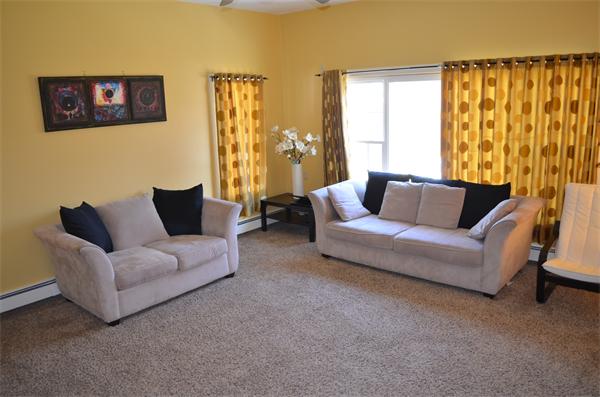 261 Marrett Road Lexington, MA 02421 - Photo 6 of 24 a living room with furniture and a large window