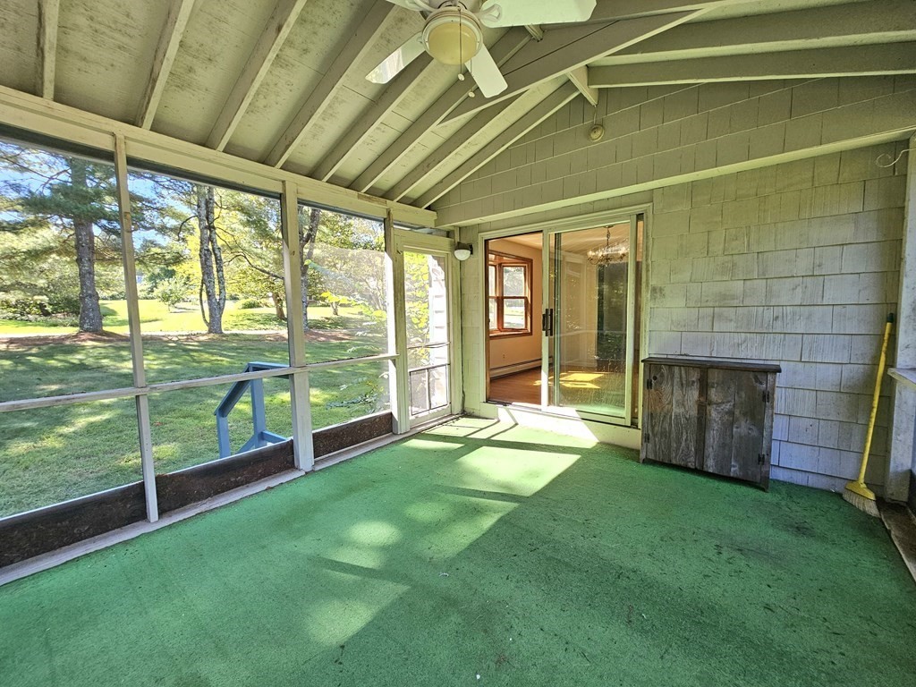 47 Stagecoach Road Amherst, MA 01002 - Photo 12 of 38 a view of an empty room with a fireplace and a yard with outer view