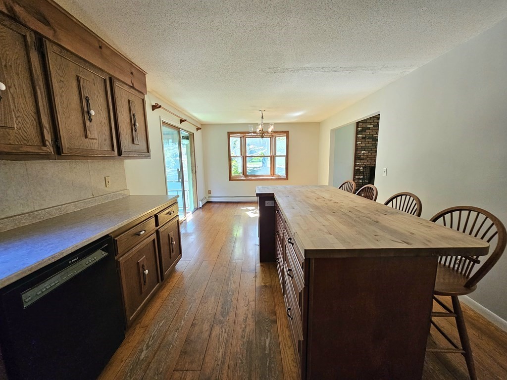 47 Stagecoach Road Amherst, MA 01002 - Photo 16 of 38 a kitchen with granite countertop a stove a sink and a refrigerator