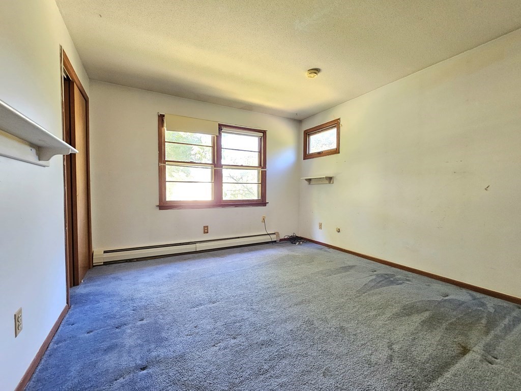 47 Stagecoach Road Amherst, MA 01002 - Photo 20 of 38 an empty room with windows