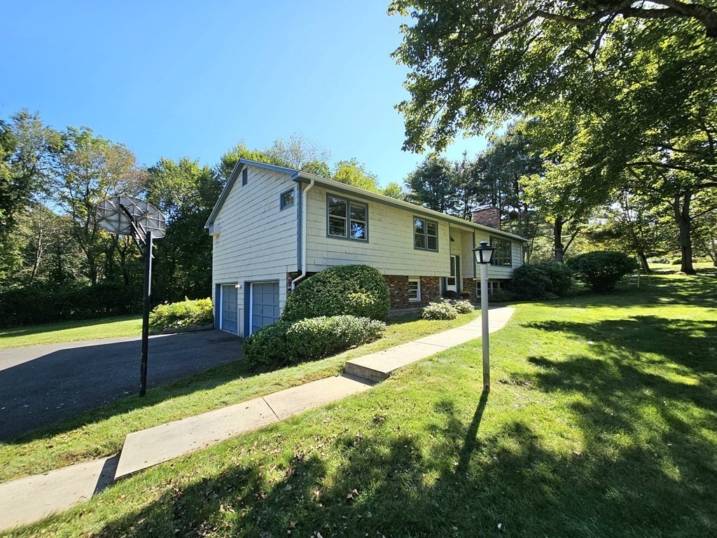 47 Stagecoach Road Amherst, MA 01002 - Photo 2 of 38 a house view with a backyard space