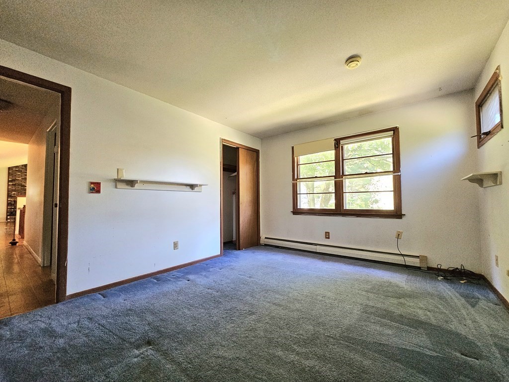 47 Stagecoach Road Amherst, MA 01002 - Photo 21 of 38 an empty room with windows and closet