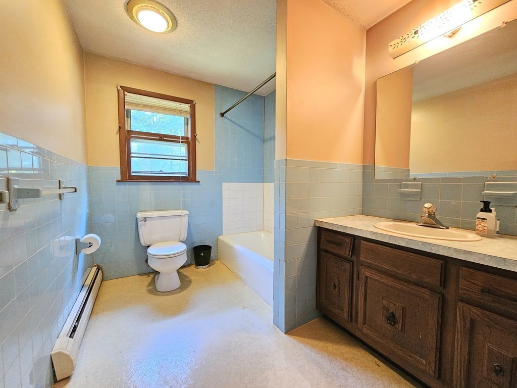 47 Stagecoach Road Amherst, MA 01002 - Photo 22 of 38 a bathroom with a toilet sink and mirror
