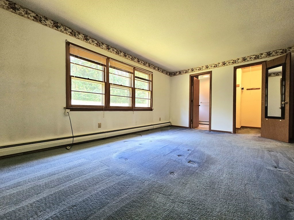 47 Stagecoach Road Amherst, MA 01002 - Photo 24 of 38 an empty room with windows