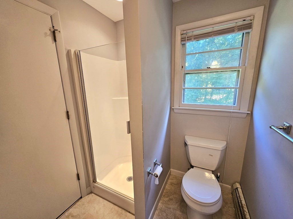 47 Stagecoach Road Amherst, MA 01002 - Photo 25 of 38 a white toilet sitting next to a window