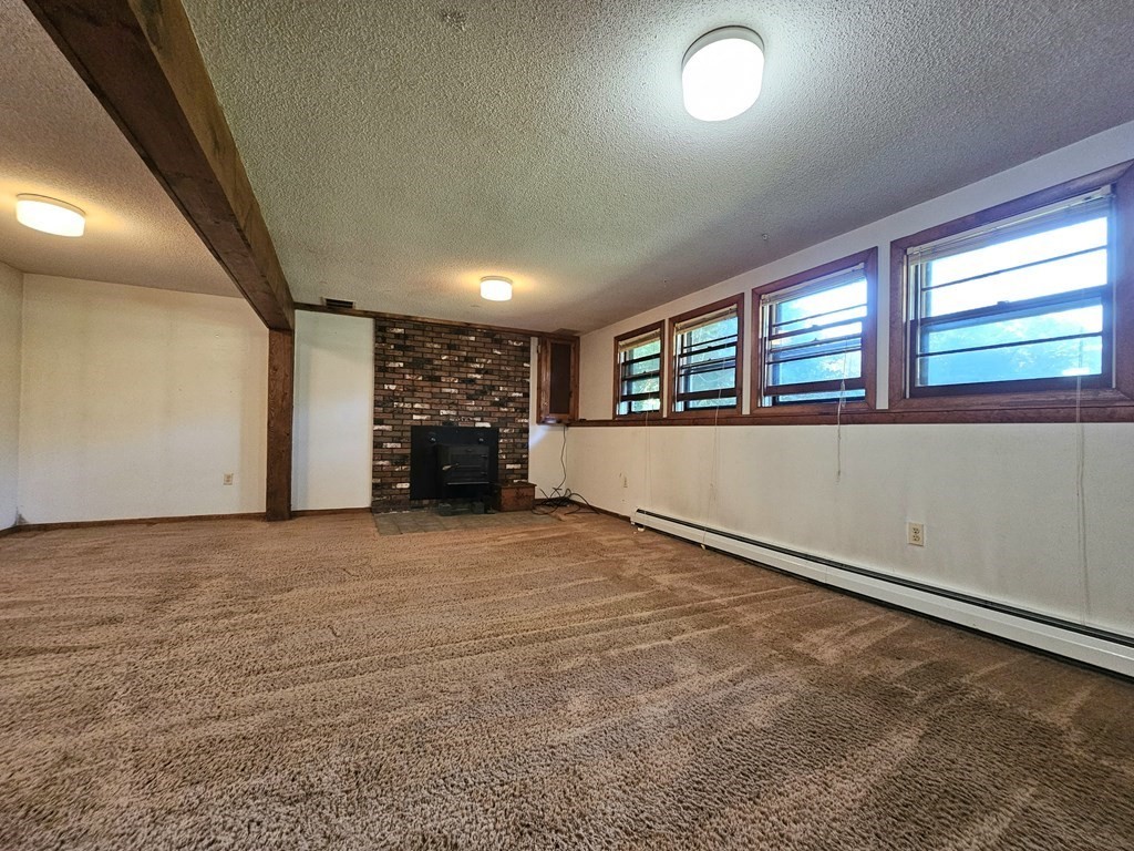 47 Stagecoach Road Amherst, MA 01002 - Photo 27 of 38 an empty room with a empty space and windows