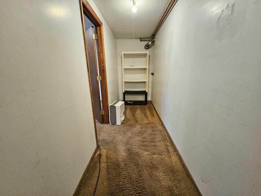 47 Stagecoach Road Amherst, MA 01002 - Photo 29 of 38 a view of a hallway with wooden floor and staircase
