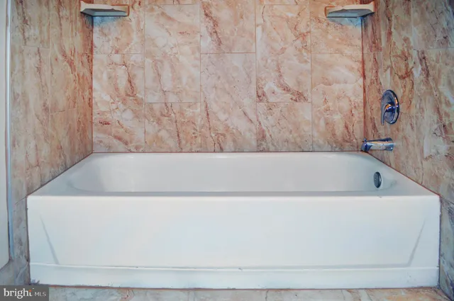 a view of a bathtub in a bathroom