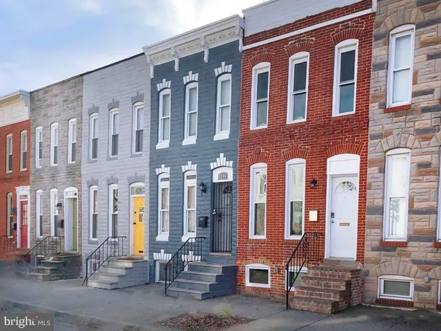 a front view of a building with many windows