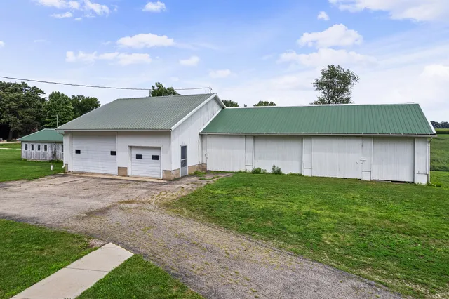 a kitchen with stainless steel appliances granite countertop a stove and a window