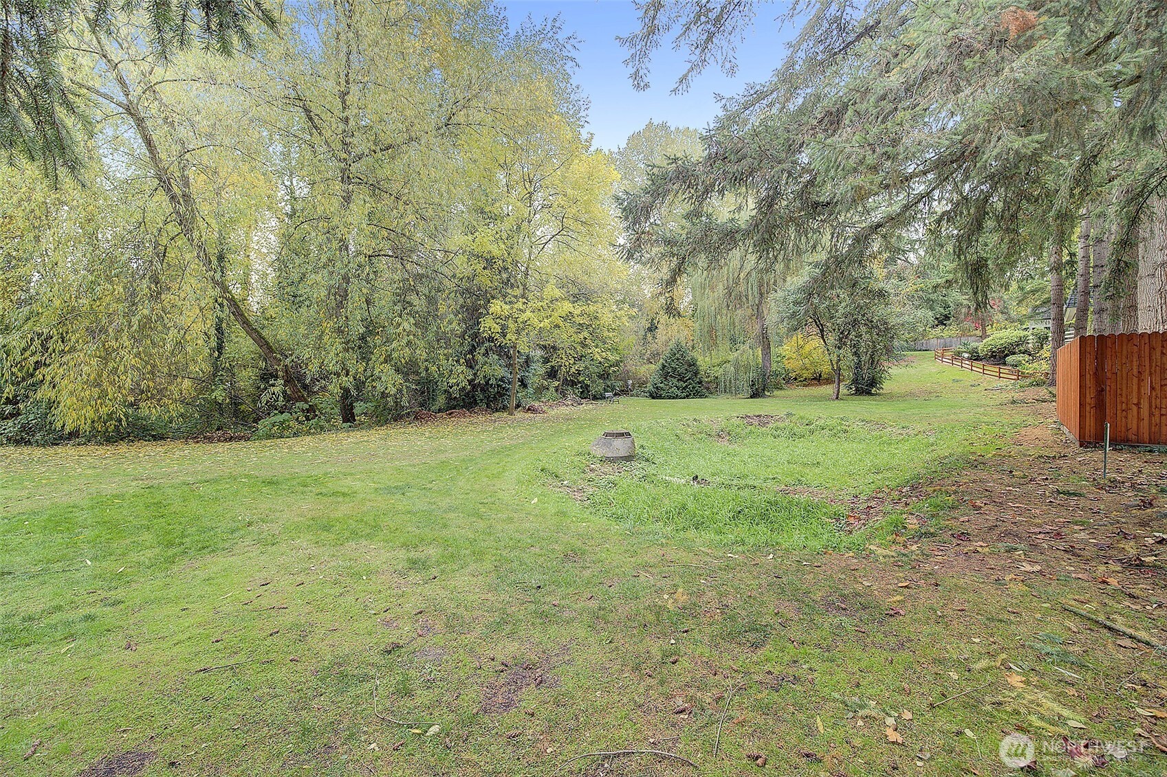9900 Northeast 124th Street, Unit 1315 Kirkland, WA 98034 - Photo 19 of 20 a view of a field with trees in background