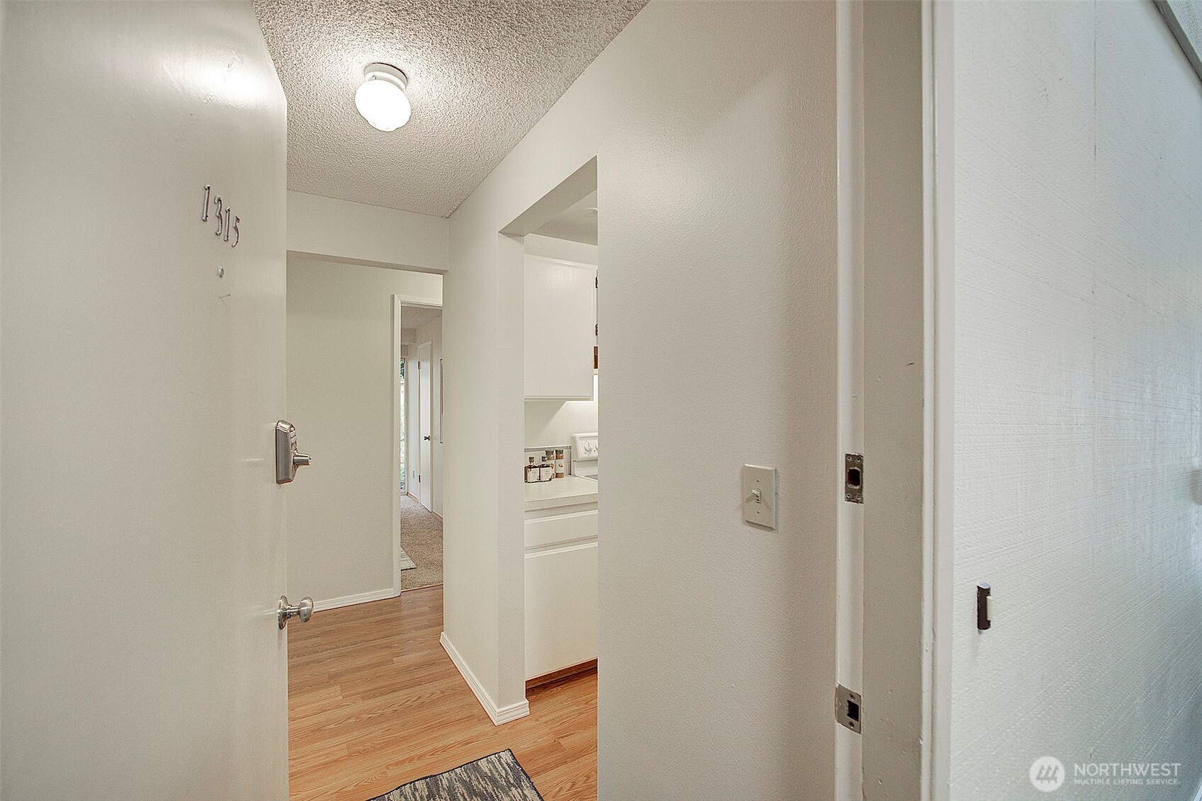 9900 Northeast 124th Street, Unit 1315 Kirkland, WA 98034 - Photo 4 of 20 a bathroom with a shower and a sink