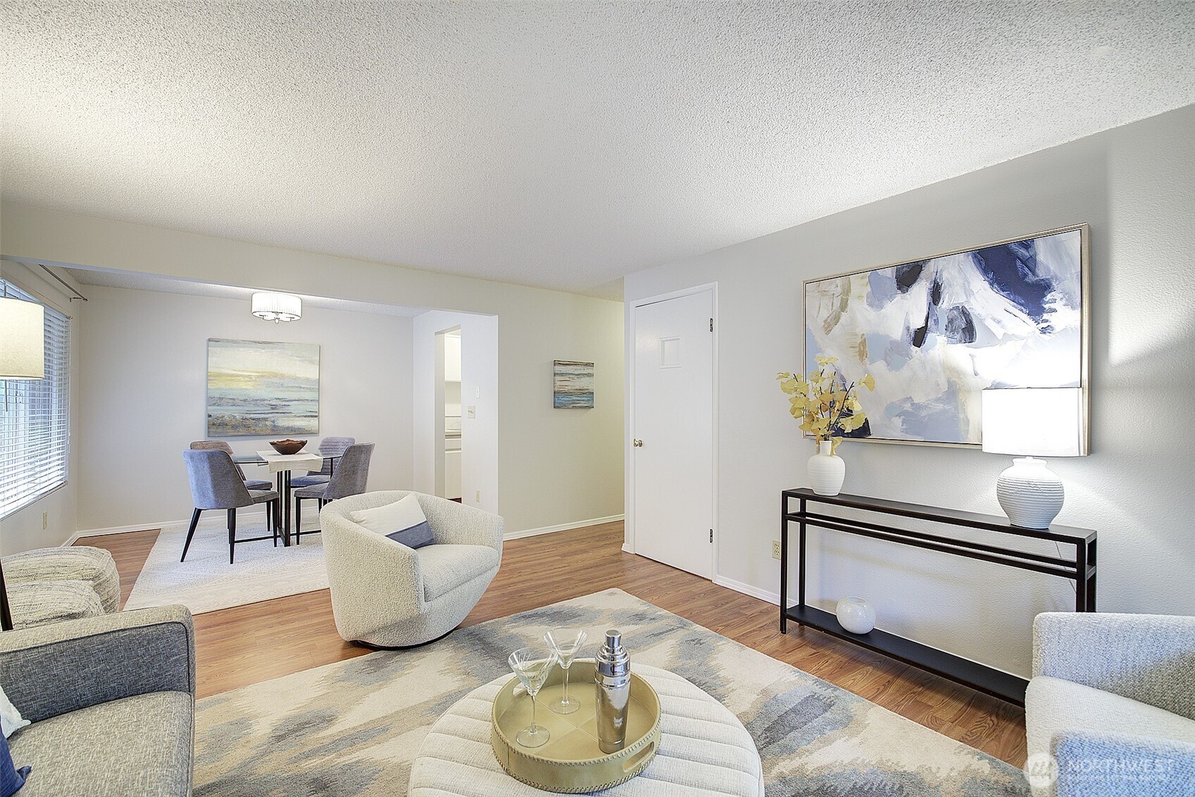 9900 Northeast 124th Street, Unit 1315 Kirkland, WA 98034 - Photo 7 of 20 a living room with furniture and a wooden floor