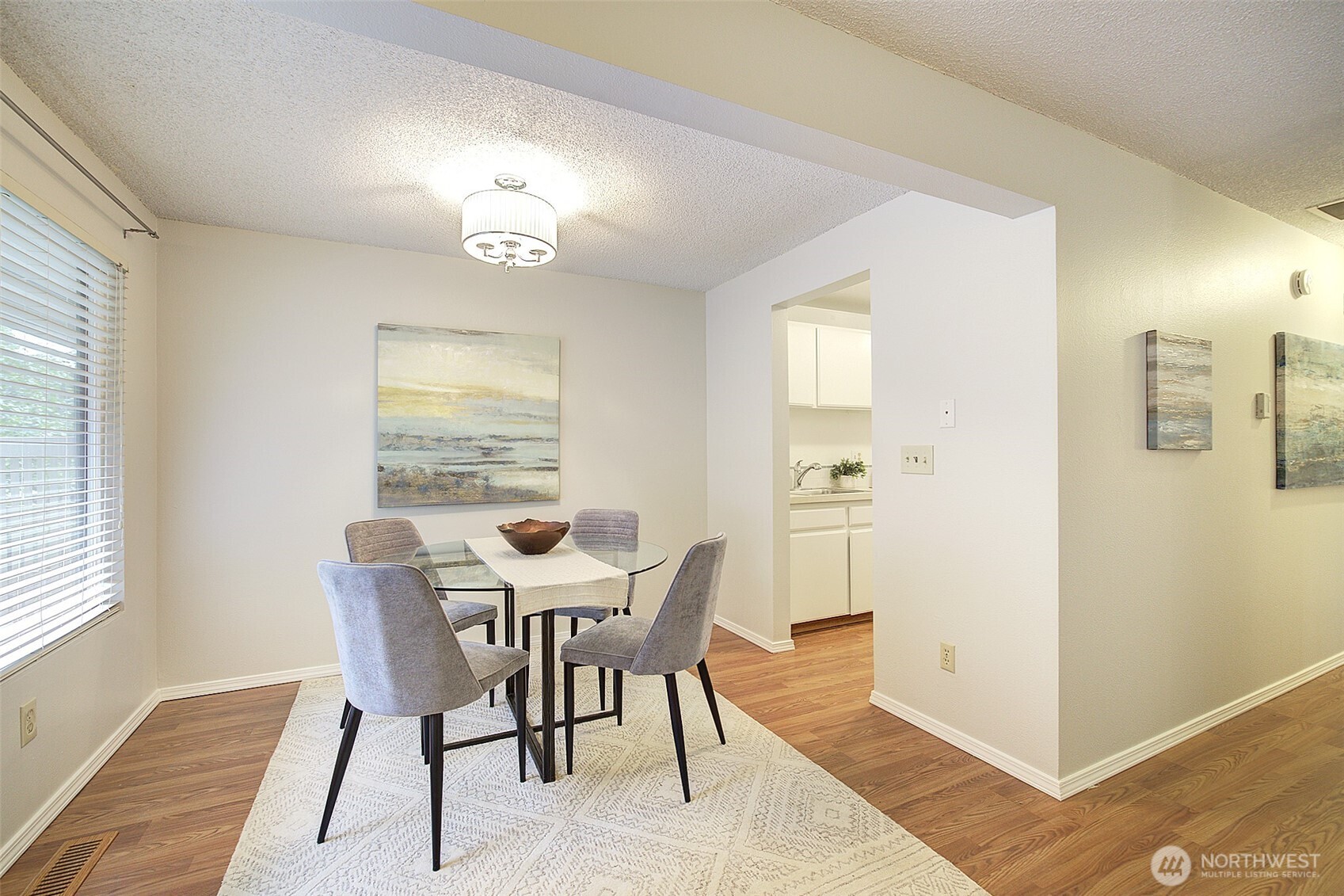 9900 Northeast 124th Street, Unit 1315 Kirkland, WA 98034 - Photo 8 of 20 a view of a dining room with furniture and a window
