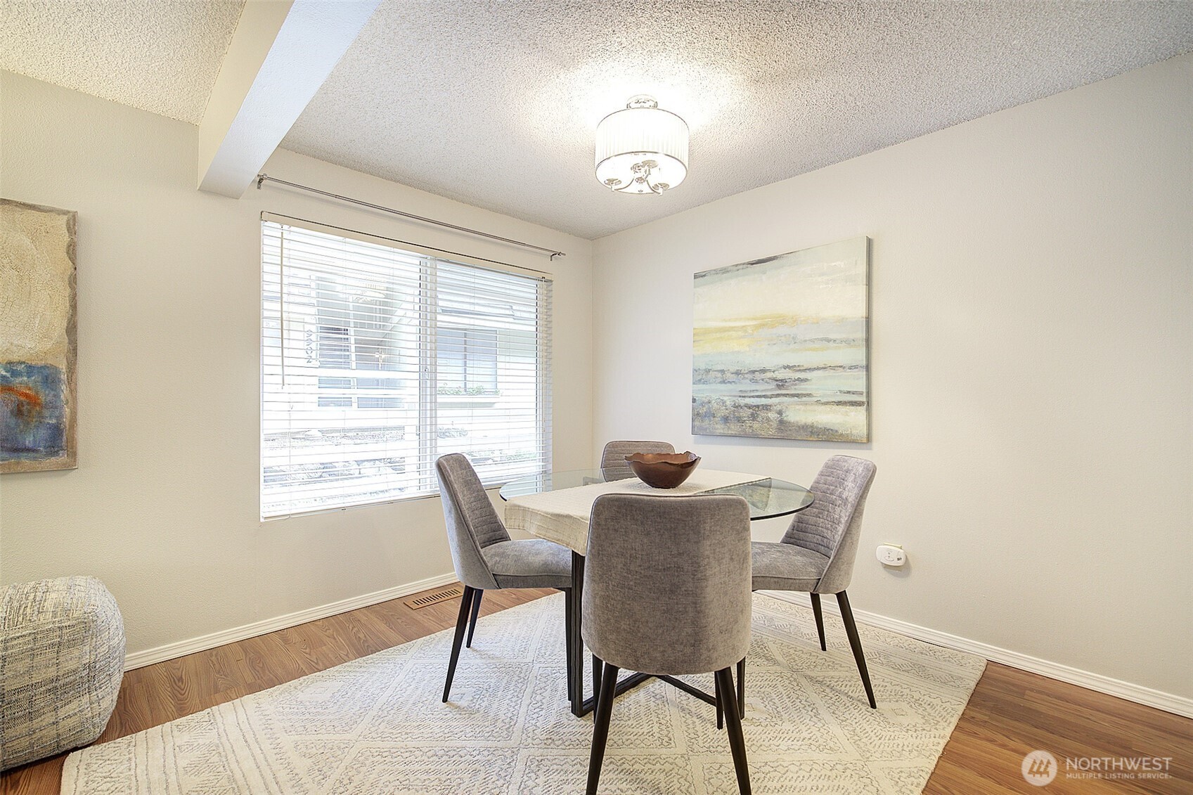 9900 Northeast 124th Street, Unit 1315 Kirkland, WA 98034 - Photo 9 of 20 a view of a dining room with furniture and chandelier