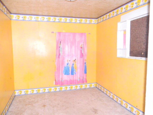 205 West Henry Street Odell, IL 60460 - Photo 6 of 10 a view of a room with window and a small space