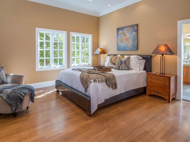 45 Clark Drive San Mateo, CA 94401 - Photo 17 of 49 a spacious bedroom with a bed and wooden floor