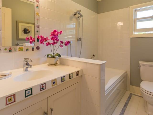 45 Clark Drive San Mateo, CA 94401 - Photo 23 of 49 a bathroom with a sink vanity mirror and toilet