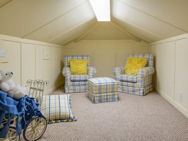 45 Clark Drive San Mateo, CA 94401 - Photo 29 of 49 a bedroom with furniture and a lamp on the wall