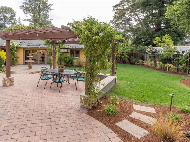 45 Clark Drive San Mateo, CA 94401 - Photo 45 of 49 a view of a patio with table and chairs potted plants and large tree