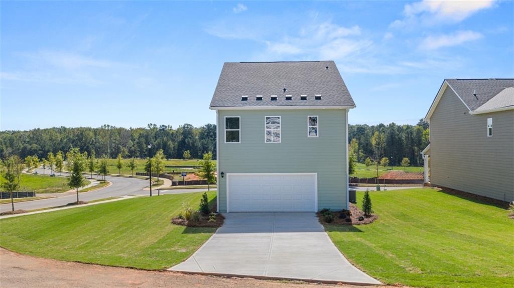 906 Stow Lane Monroe, GA 30655 - Photo 2 of 28 a view of a house with a yard