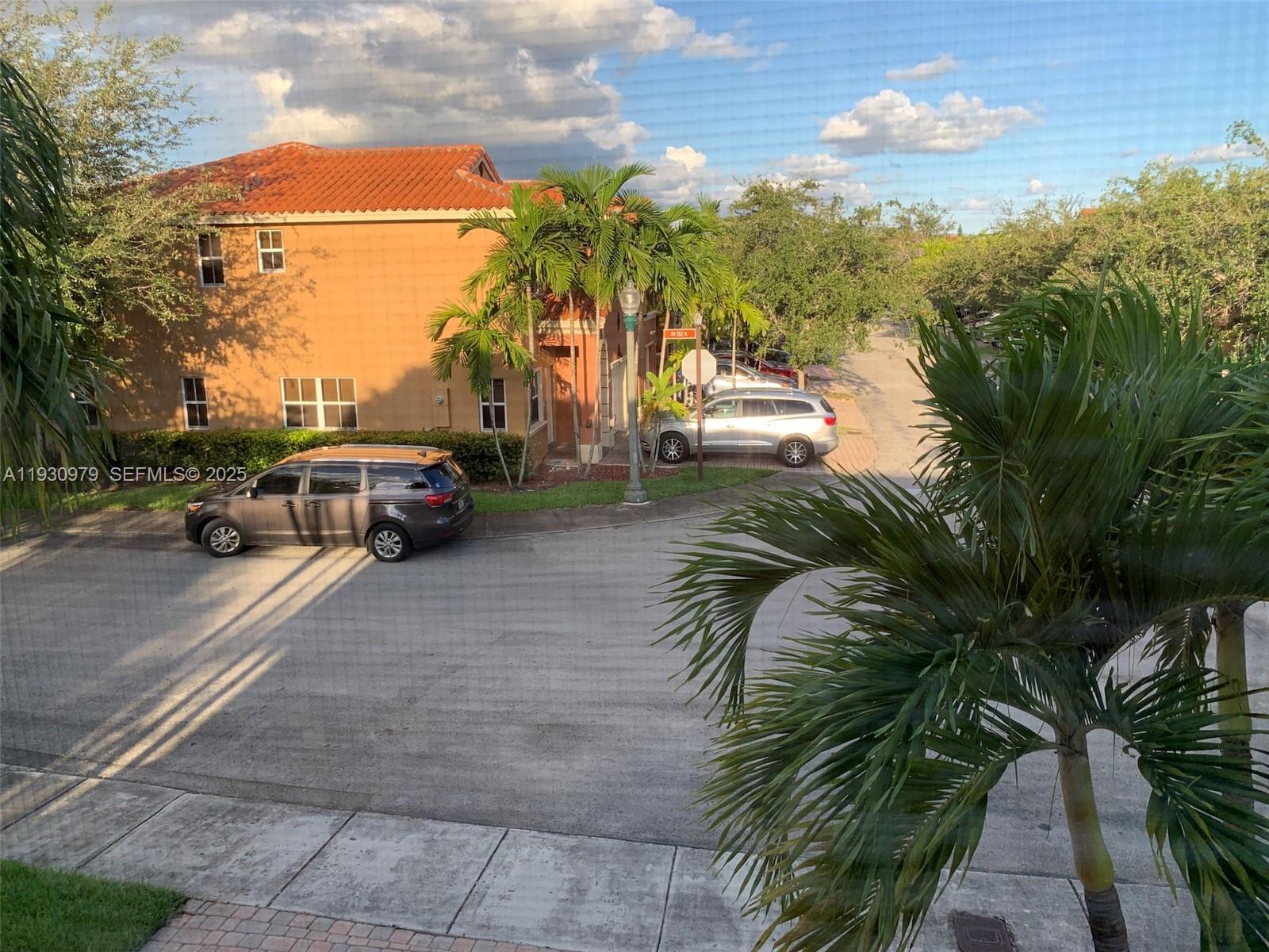 3150 Southwest 152nd Place, Unit 3150 Miami, FL 33185 - Photo 19 of 25 a cars parked on the side of a street