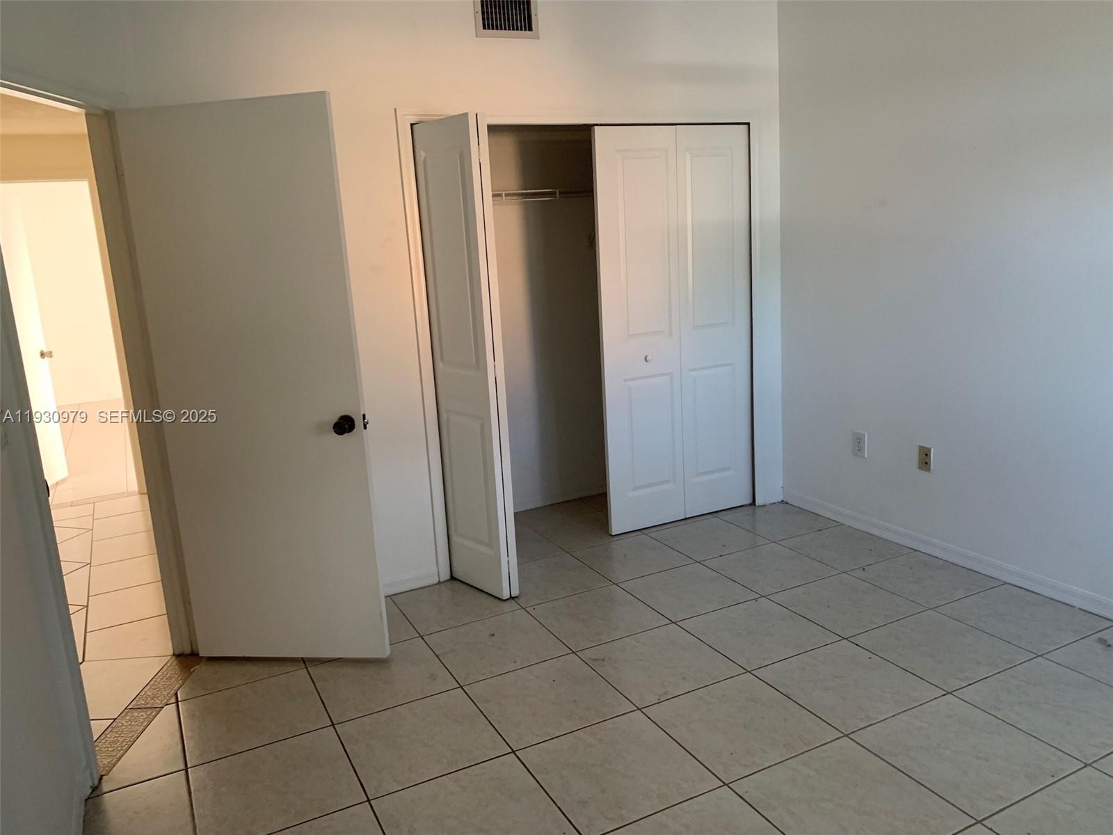 3150 Southwest 152nd Place, Unit 3150 Miami, FL 33185 - Photo 21 of 25 an empty room with windows