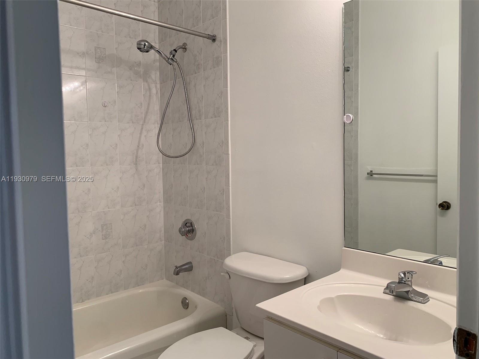 3150 Southwest 152nd Place, Unit 3150 Miami, FL 33185 - Photo 22 of 25 a bathroom with a sink toilet and shower