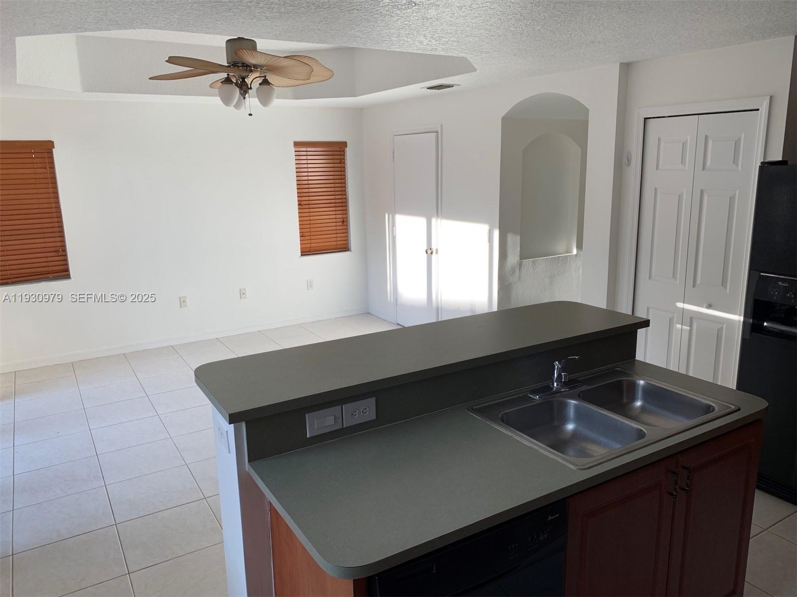 3150 Southwest 152nd Place, Unit 3150 Miami, FL 33185 - Photo 5 of 25 a bathroom with a sink and a mirror