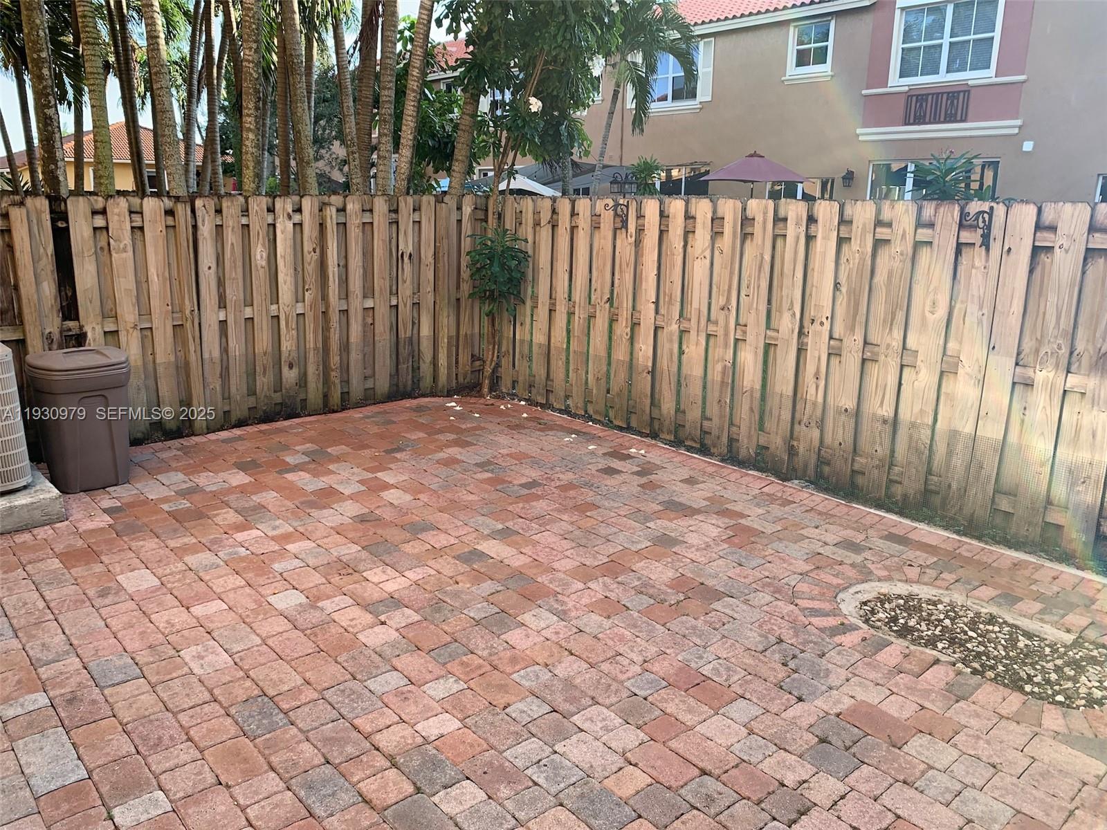 3150 Southwest 152nd Place, Unit 3150 Miami, FL 33185 - Photo 7 of 25 a view of a wooden fence