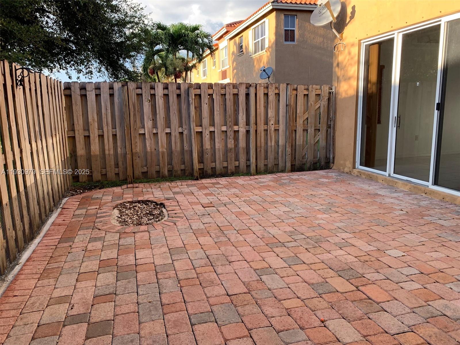 3150 Southwest 152nd Place, Unit 3150 Miami, FL 33185 - Photo 9 of 25 a view of backyard with wooden fence