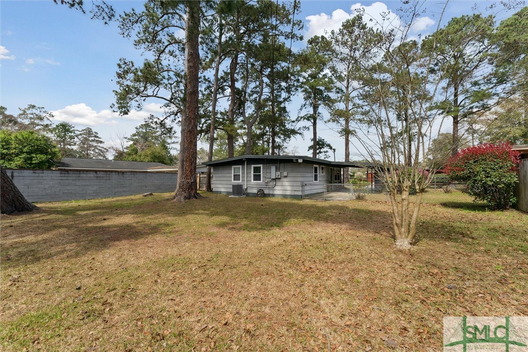 321 Woodley Road Savannah, GA 31419 - Photo 23 of 26 Fully fenced in backyard with tall privacy fence.