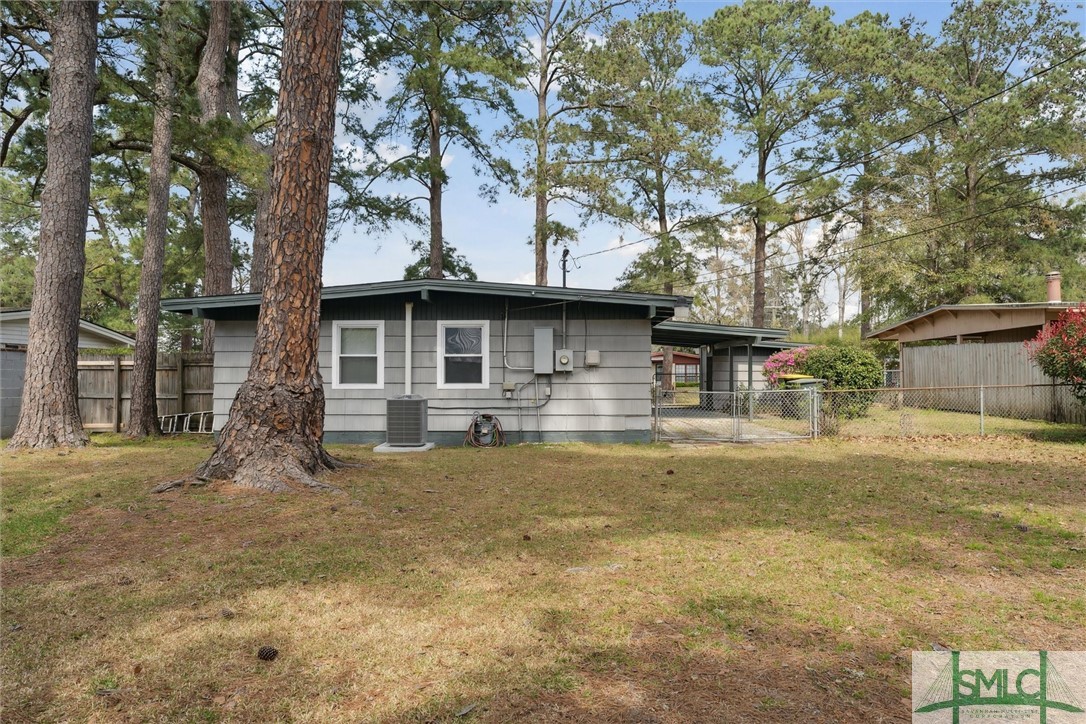 321 Woodley Road Savannah, GA 31419 - Photo 24 of 26 Fully fenced in backyard with tall privacy fence.