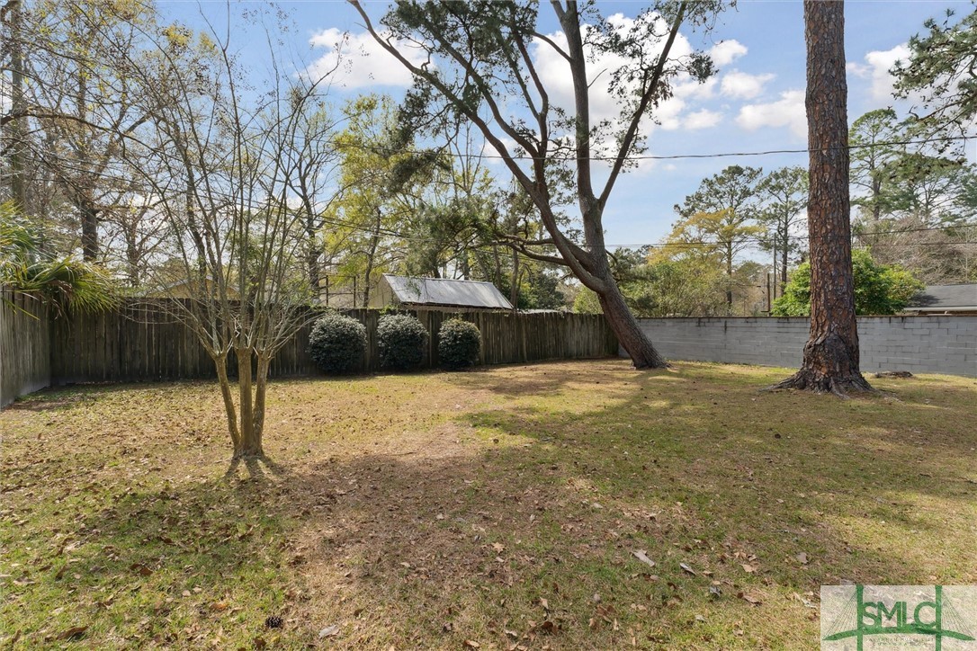 321 Woodley Road Savannah, GA 31419 - Photo 25 of 26 Fully fenced in backyard with tall privacy fence.