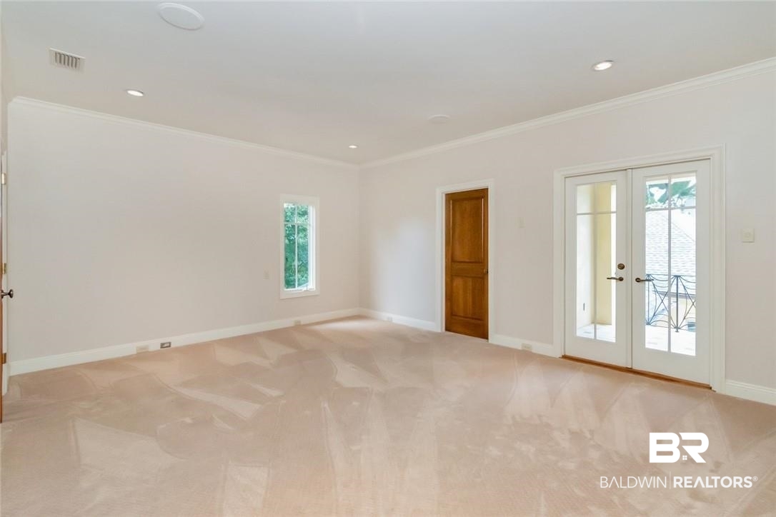 4 Chancery Court Mobile, AL 36608 - Photo 39 of 54 Carpeted spare room with french doors and crown molding